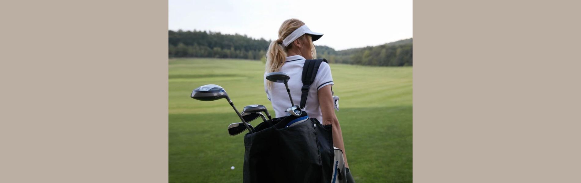 Golfer carrying bag